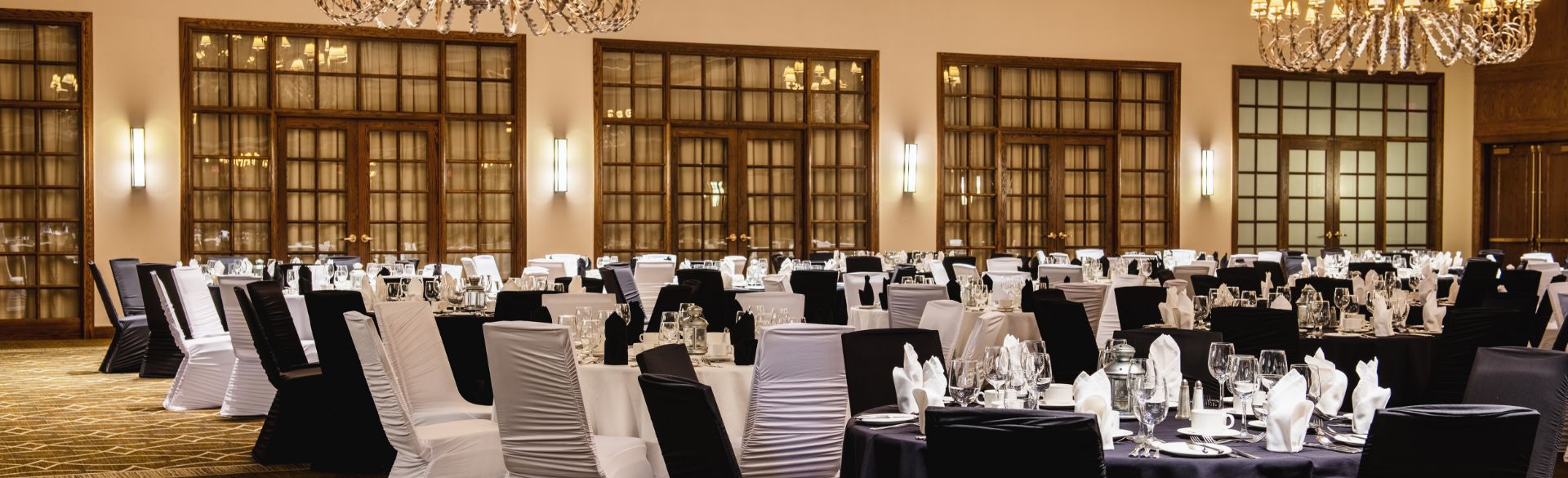 An image showcasing the expansive and inviting meeting hall at Red Deer Resort, exuding a sense of spaciousness and warmth.